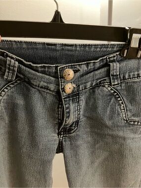 High-Rise Washed Blue Jeans with Dual Metal Buttons